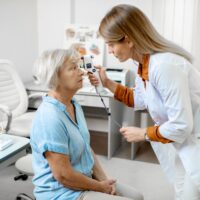 ophthalmologist-measuring-eye-pressure-to-a-senior-2022-01-18-23-45-29-utc