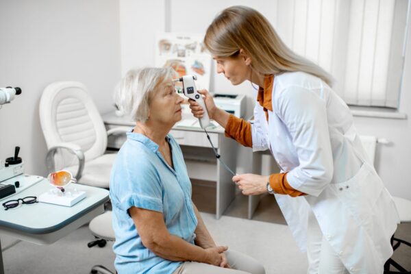 ophthalmologist-measuring-eye-pressure-to-a-senior-2022-01-18-23-45-29-utc